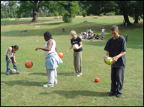 Children Playing Football In The Park