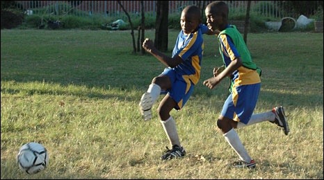 Children Playing Football In The Street