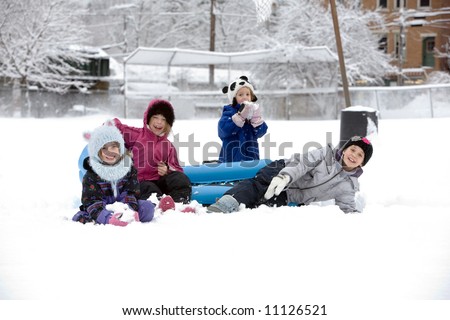 Children Playing Outside In The Snow