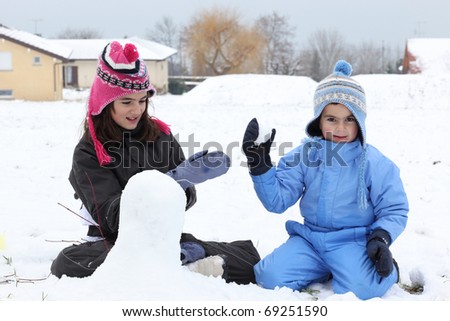 Children Playing Outside In The Snow