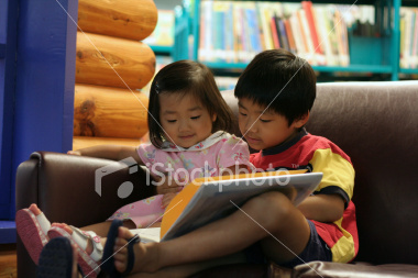 Children Reading Books In Library