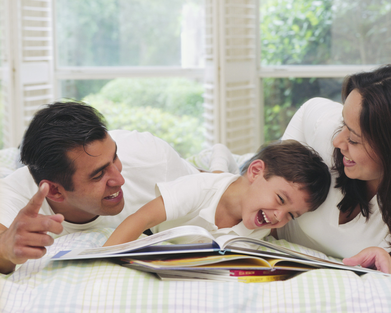 Children Reading Books With Parents