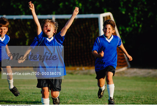 Young Children Playing Football